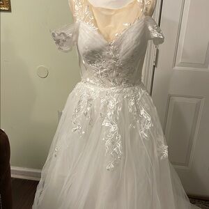 Elegant White Embroidered wedding Gown with lace in the back